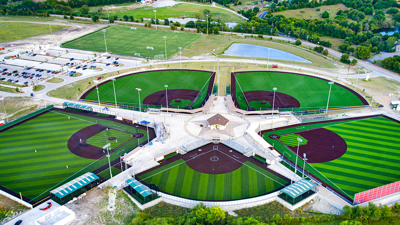 Aerial image of four baseball diamonds. 