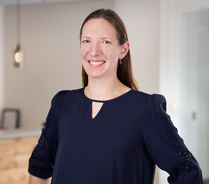 Professional Headshot of Katie Penning wearing a black long sleeve top