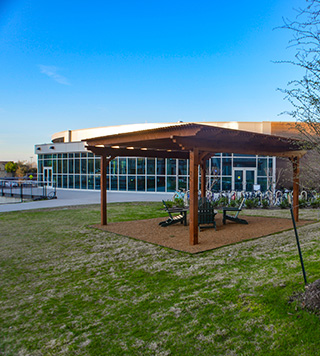 Image of a single-story living and learning center.