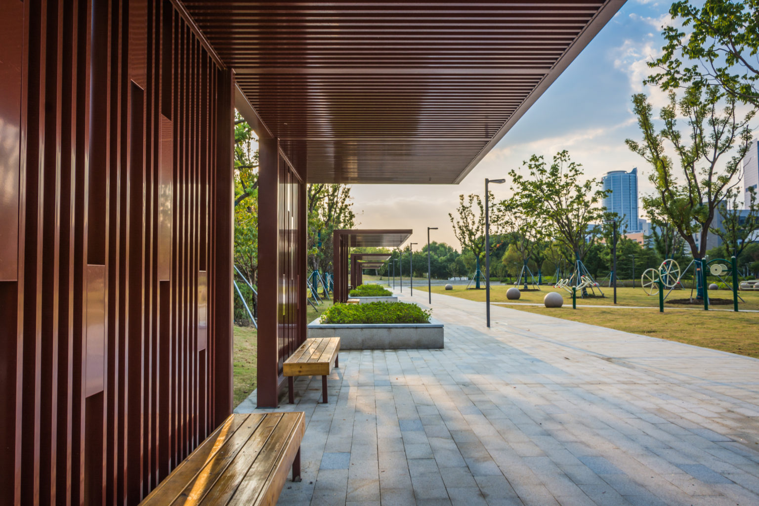 park benches covered with a wooden awning