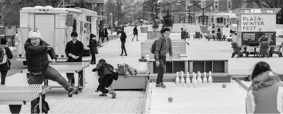 People outside doing a variety of activities in one space