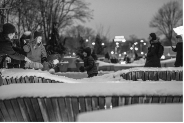 People sitting on outdoor seating in the winter